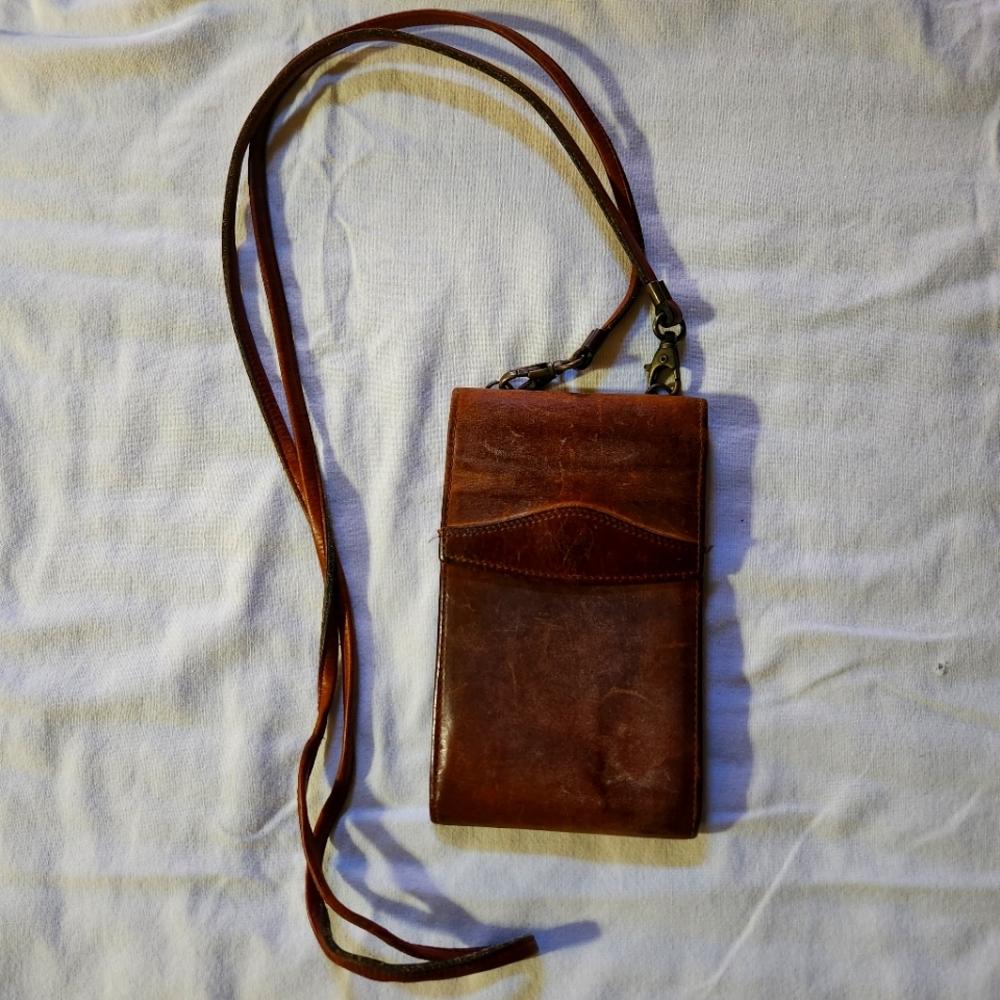 Vintage brown leather Timberland wallet bag.  Excellent weathered condition.